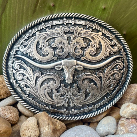 Montana Buckle Money Clip in silver, featuring a longhorn motif surrounded by western filigree and barbed wire details - A550S. Available at Blair's Western Wear, Marble Falls, TX.