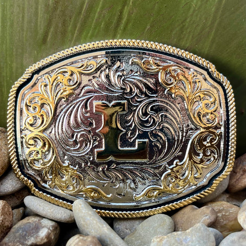 Montana Silversmiths Buckle in silver, featuring intricate filigree design with a prominent letter 'L' - A1047L. Available at Blair's Western Wear, Marble Falls, TX.