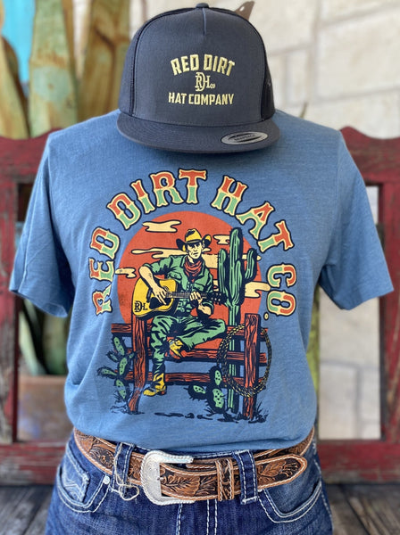 Men's Blue, Orange and Green Red Dirt T-Shirt with "Red Dirt Hat Co." Logo and Cowboy Playing Guitar sitting on Fence Graphic - RDHCT118 - BLAIR'S Western Wear located in Marble Falls TX