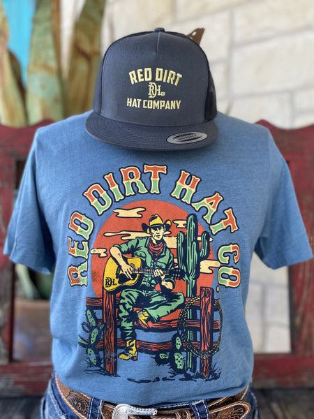 Men's Blue, Orange and Green Red Dirt T-Shirt with "Red Dirt Hat Co." Logo and Cowboy Playing Guitar sitting on Fence Graphic - RDHCT118 - BLAIR'S Western Wear located in Marble Falls TX